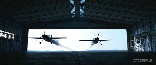 Two Planes Crazily Fly Through A Hangar In An Epic Stunt