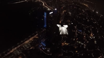 Badass Glowing Wing Suit Flight Over A City At Night