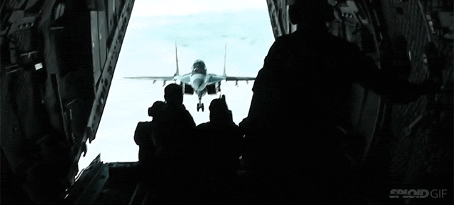 MiG-29 Flies Impossibly Close To An Aeroplane’s Open Rear Door