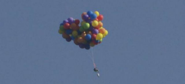 Hero Man Flies Balloon Chair Through The Sky