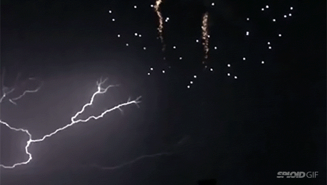 Spectacular Lightning Strike Hits While Fireworks Explode