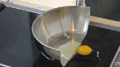 Cooking Food In A Pan Cut In Half Shows The Magic Of Induction Cooking