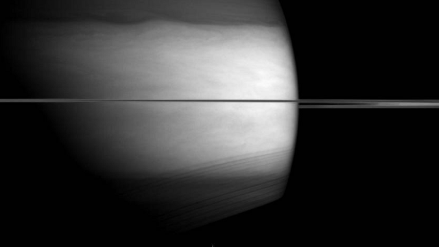 Saturn Looms Eerily In Infrared