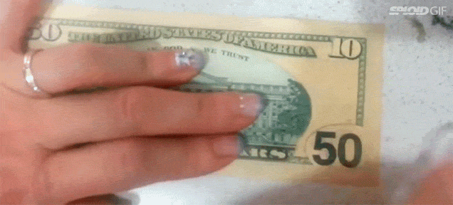 Watch A US $50 Note Get Rubbed Off To Reveal A $10 Note