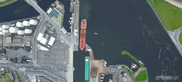 Incredible Overhead View Of An Oil Tanker Perfectly Docking At A Narrow Port