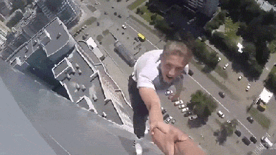 Watching These Daredevils Do Crazy Tricks Off A 40-Storey Building Made My Knees Disappear