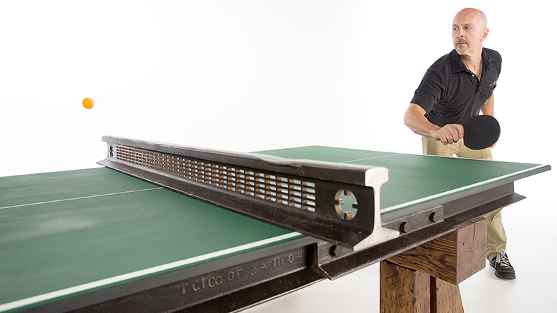 Steel And Wood From A Salvaged Railroad Support This Rustic Ping Pong Table