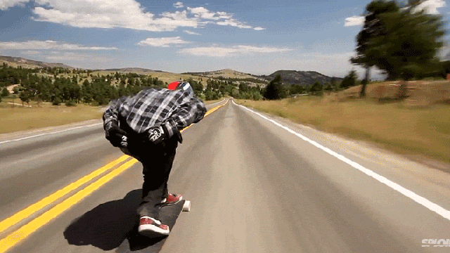 Racing Down The Street On A Longboard At 70mph Blurs The World Around You