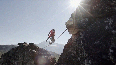 Riding A Bike On A Slackline In The Mountains Is Psycho Madness