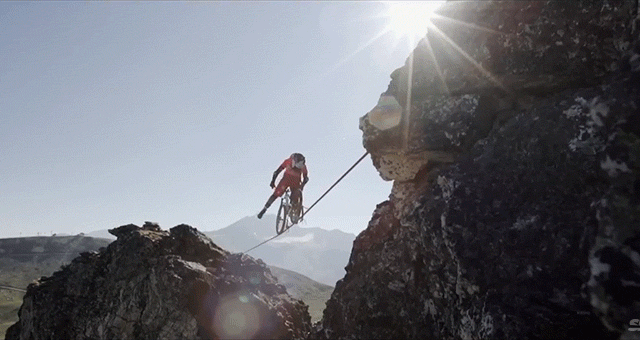 Riding A Bike On A Slackline In The Mountains Is Psycho Madness