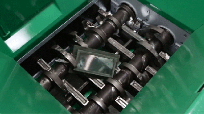 Watch Bulletproof Glass Get Crushed And Eaten By A Shredder