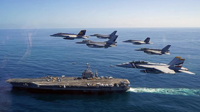 Cool Photo Of Fighter Jets Flying Over An Aircraft Carrier