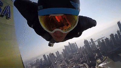 Watch Crazy Guys In Wingsuits Fly Right Next To The Face Of City Buildings