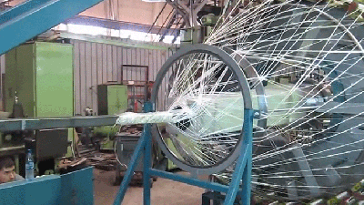 Watching This Giant Braiding Machine Weave Together Fibreglass Is So Satisfying