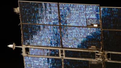 Solar Panel Is A Glittering Blue Mosaic Against The Blackness Of Space