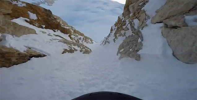 Daredevil Skis Through An Impossibly Narrow Gap In The Mountains