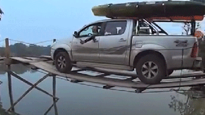 Watching A Truck Towing A Boat Drive Over A Flimsy Wooden Bridge Is So Stressful