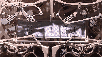 This Impossibly Complicated Mechanical Clock Re-Writes The Time Every Minute