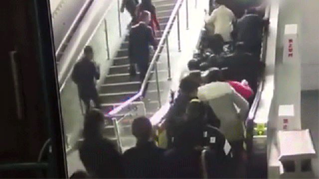 A Human Avalanche Is What Happens When An Escalator Suddenly Reverses
