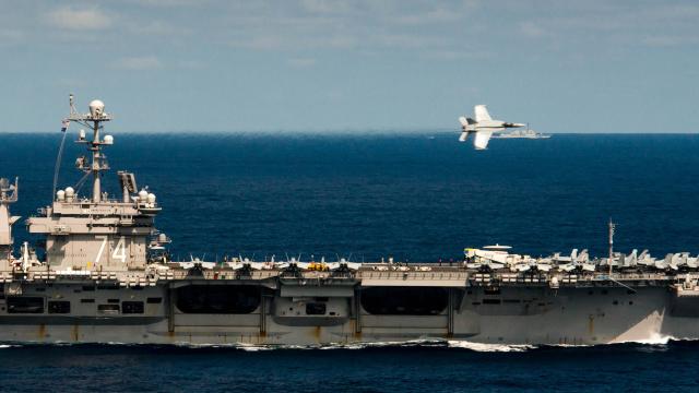 Cool Photo Of A F-18 Flyby Of An Aircraft Carrier
