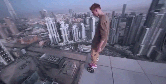 Daredevil Rides A Hoverboard Onto The Very Edge Of A Skyscraper