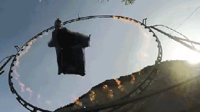 Man In Wingsuit Flies Straight Through A Ring Of Fire
