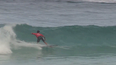 Surfer Does His Best Superhero Impression With Effortless Backflip