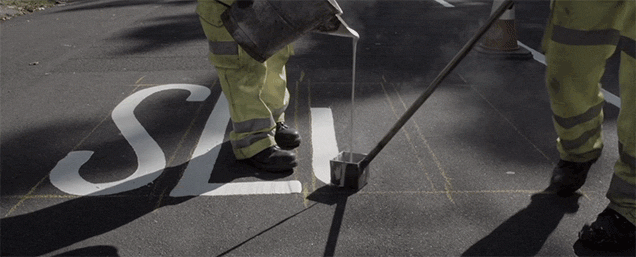 Watching Workers Paint Letters On A Street Is So Soothing