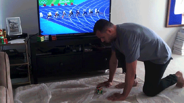 Watch A Rubik’s Cube Master Race The Fastest Man On Earth