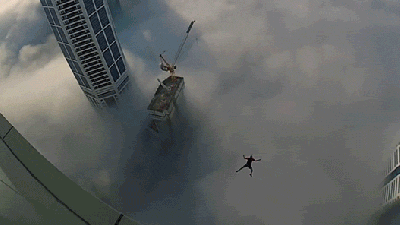BASE Jumping Off A Balcony Of A Skyscraper Above The Clouds Is Pure Crazy