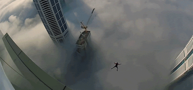 BASE Jumping Off A Balcony Of A Skyscraper Above The Clouds Is Pure Crazy
