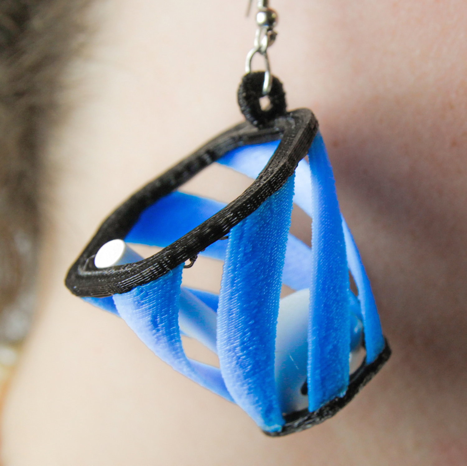 These 3D-Printed Earrings Catch Apple’s AirPods When They Fall Out