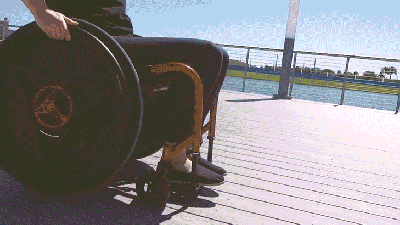 Rolling This Wheelchair’s Wheels Backwards Somehow Propels It Forward