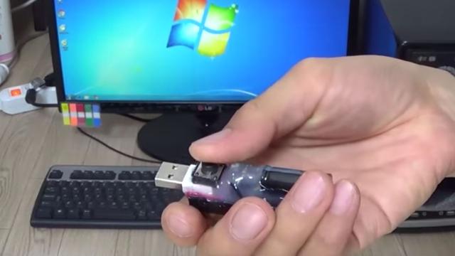 This Computer-Destroying Thumb Drive Is Hacked Together From Old Camera Parts