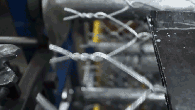 This Machine Weaves Chain Link Fences Like It’s Knitting A Jumper