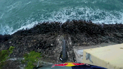 Watch This Cyclist Front Flip Off A Cliff Right Into The Freaking Ocean