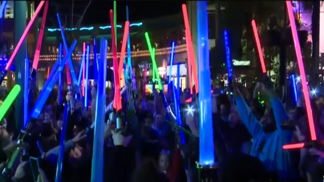 Star Wars Fans Raise Their Lightsabers To The Sky For Carrie Fisher