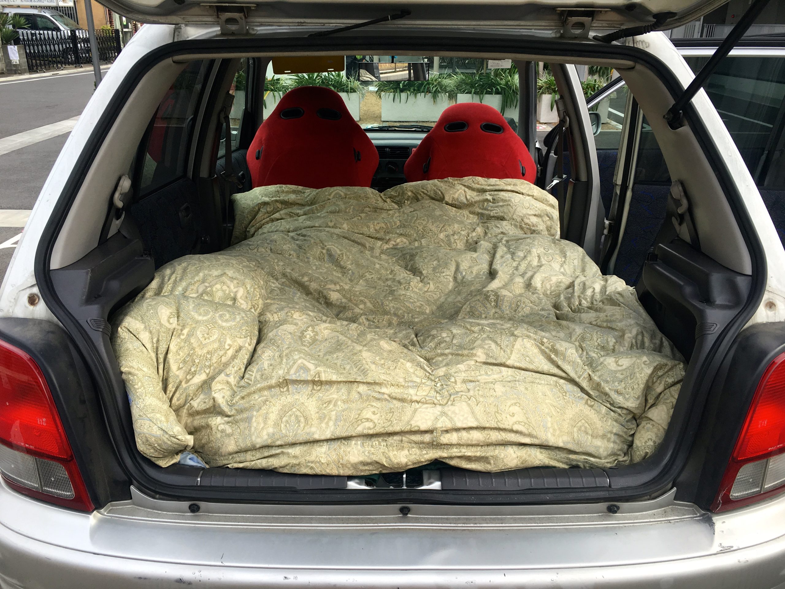 How To Turn Your Hatchback Into A Mini-Camper For Cheap Road Trips