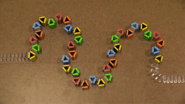Collapsing, Colour-Changing Dominoes Are Like Watching A Rainbow Die