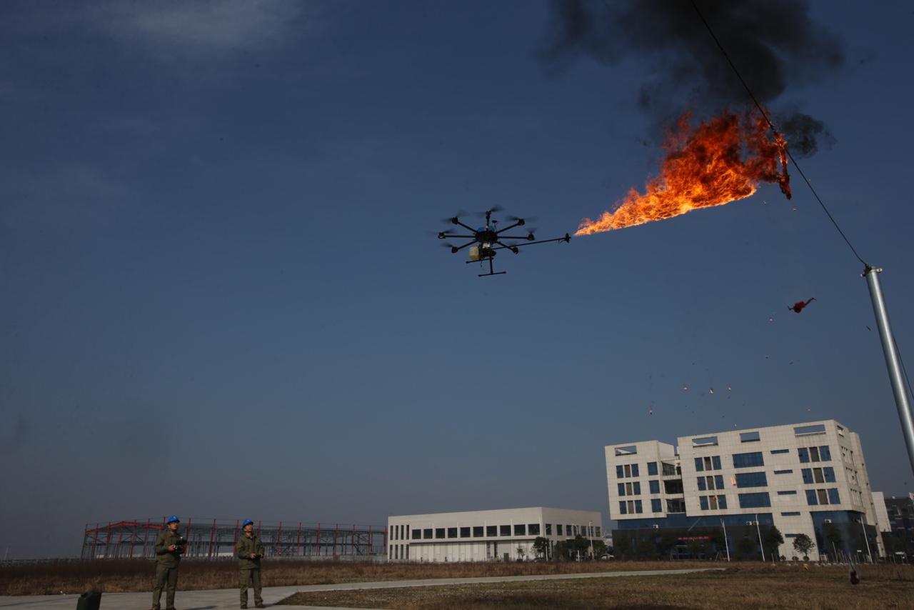 Power Company Sends Fire-Spewing Drone To Burn Garbage Off High-Voltage Wires