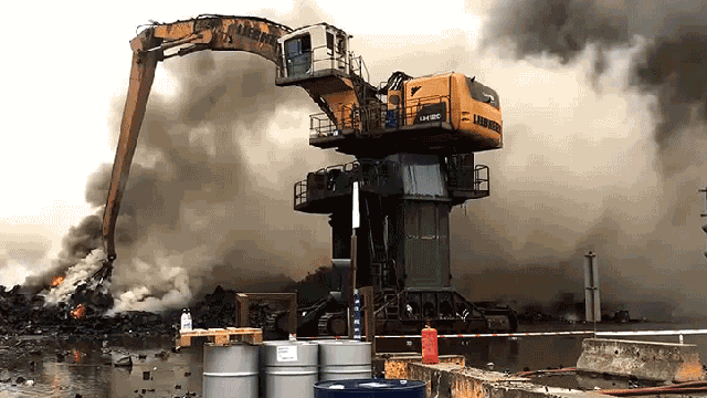 Watch A Giant Excavator Battle A Massive Garbage Fire