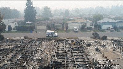 Drone Video Shows Postal Worker Still Delivering Mail In Neighbourhood Ravaged By Wildfire