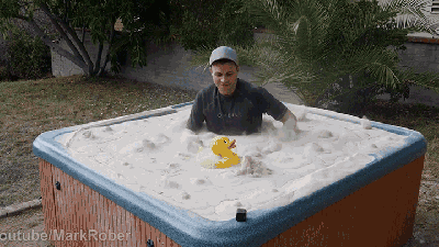What Kind Of Sorcery Lets People Swim In This Sand-Filled Hot Tub?