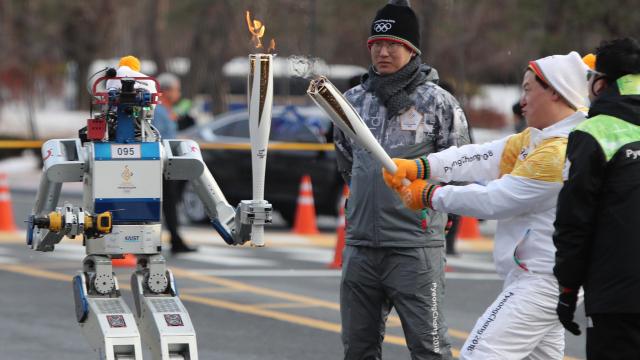 This Robot Just Carried The Pyeongchang 2018 Olympics Torch As It Cut Through A Wall