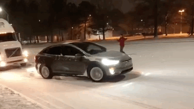 Watch This Tesla Model X Pull A Semi Truck Up A Snowy Hill
