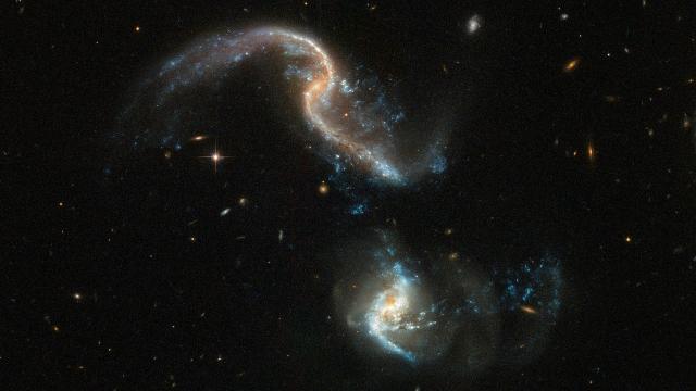 The Hubble Space Telescope Captured This Beautiful Image Of Two Galaxies Merging