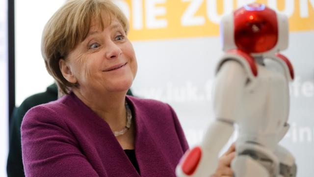 German Leader Angela Merkel Still Way Too Friendly With Robots