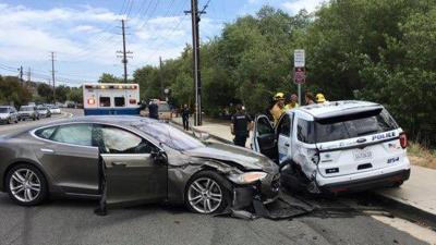 Tesla Car In Autopilot Mode Slams Into Parked Police Vehicle In California