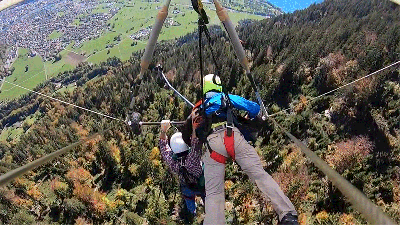 Watch A First-Time Hang Glider Hang On For Dear Life After Realising He’s Not Strapped In