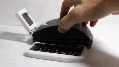 There’s A Fully Working Computer, Including A Retractable Keyboard, Hidden Inside This Mouse